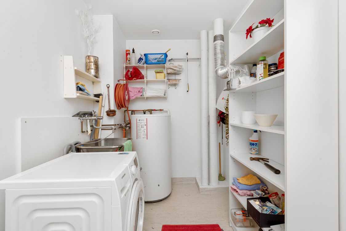 Laundry room interior with moisture-prone walls and ceiling suited to wet-area plasterboard Laundry room interior with moisture-prone walls and ceiling suited to wet-area plasterboard