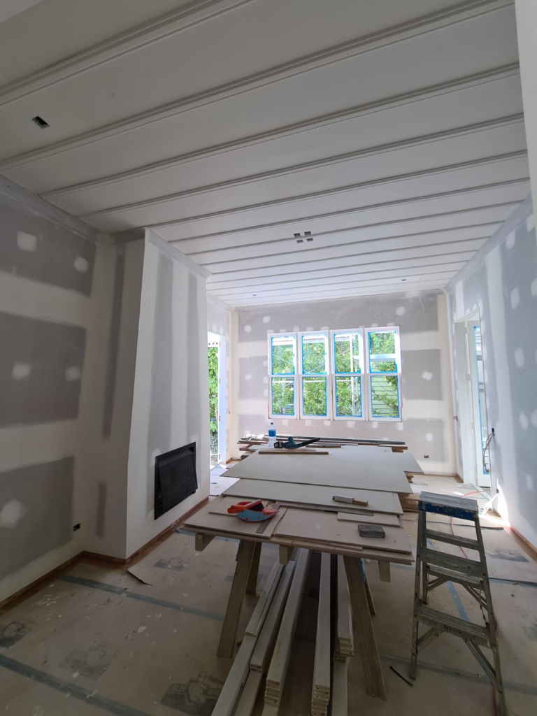 Living room GIB stopping in Auckland showing a flat paint-ready Level 4 wall and ceiling